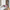 Rossetto Teriam Service DEBBY LONG LAST KISSMYLIPS N.03 color nude su tavolo di marmo con fiore e libro
